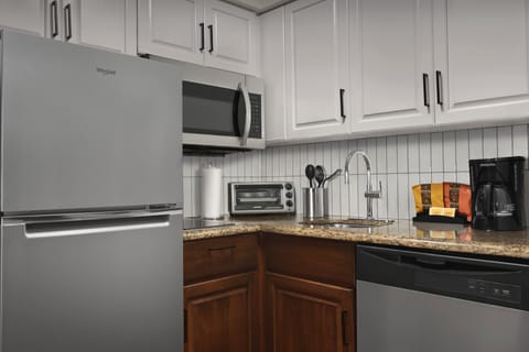 Suite, 2 Bedrooms | Private kitchen | Full-size fridge, microwave, stovetop, dishwasher