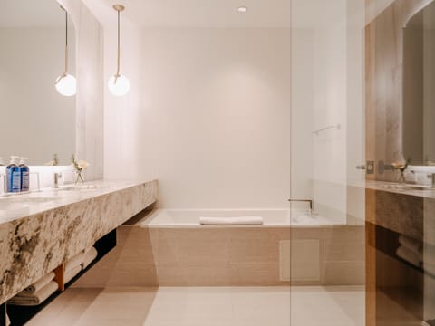 Designer toiletries, hair dryer, bathrobes, slippers