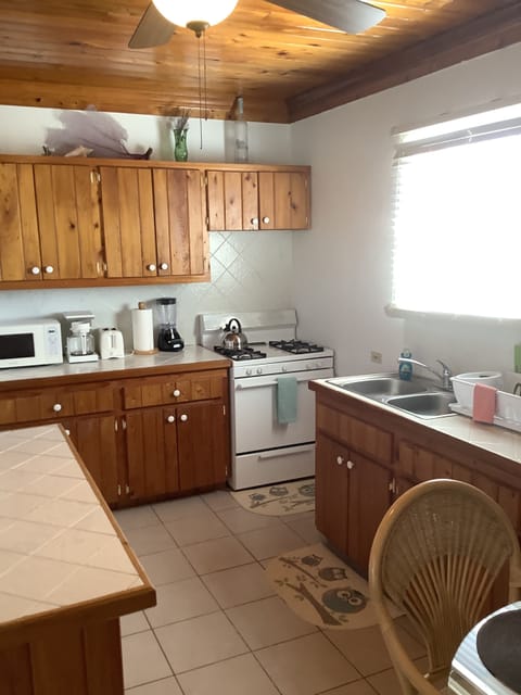 House, 2 Bedrooms | Private kitchen | Full-size fridge, microwave, stovetop, coffee/tea maker