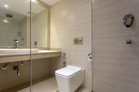 Deluxe Room | Bathroom | Rainfall showerhead, slippers, bidet, towels