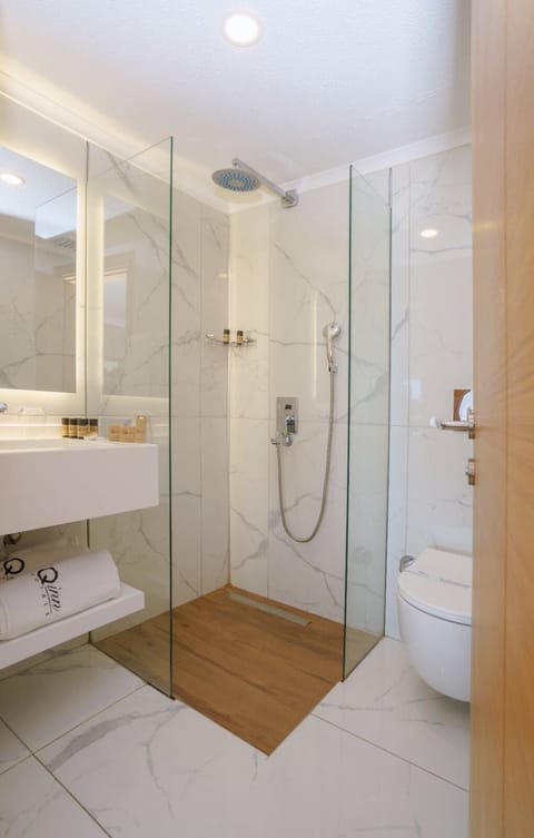 Family Suite, 2 Bedrooms, Sea View | Bathroom | Shower, rainfall showerhead, hair dryer, slippers