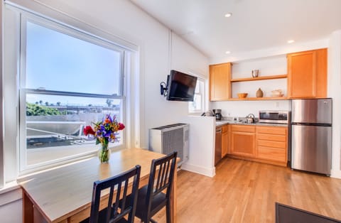 One Bedroom Suite, Street View | Private kitchen | Fridge, microwave, stovetop, dishwasher