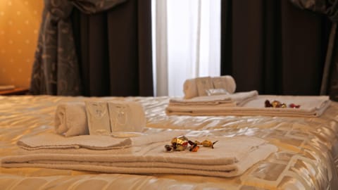 Premium bedding, down comforters, in-room safe, desk