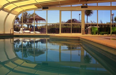 Indoor pool, outdoor pool, pool umbrellas, sun loungers