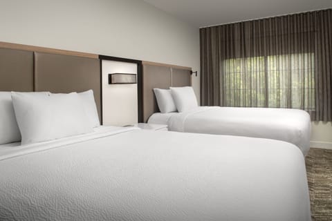 Premium bedding, down comforters, in-room safe, desk