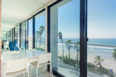 2 Bedroom Condominium - 203 | Living area | 32-inch flat-screen TV with cable channels, TV, DVD player