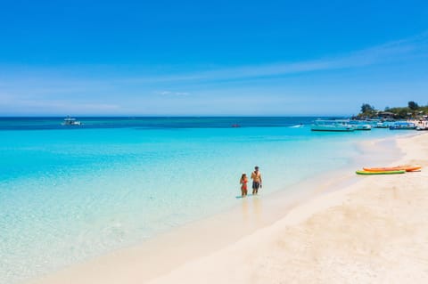 On the beach, white sand, free beach cabanas, sun loungers