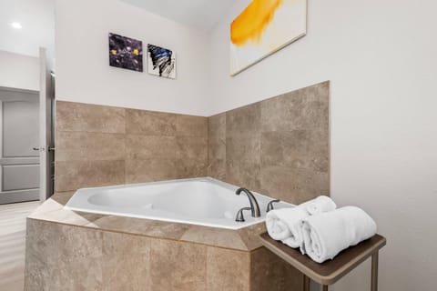 Suite, 1 King bed, Heart Shaped Whirlpool Tub, Non Smoking | 1 bedroom, desk, laptop workspace, iron/ironing board