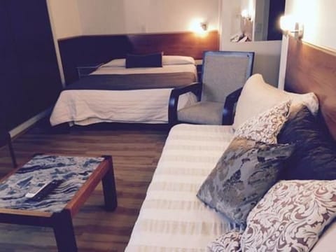 Triple Room | Minibar, cribs/infant beds, free WiFi