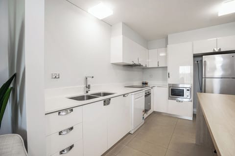 Deluxe One Bedroom Apartment | Private kitchen | Microwave, coffee/tea maker, electric kettle, toaster