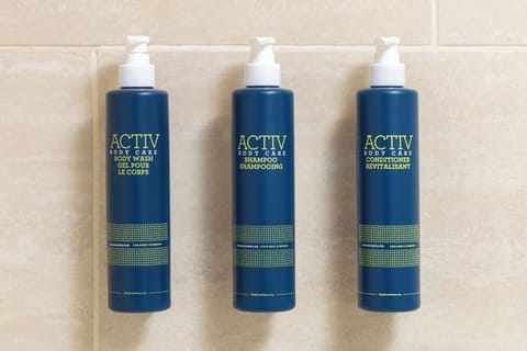 Designer toiletries, hair dryer, towels