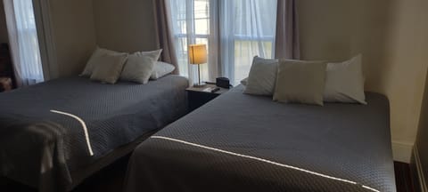 Double Room, 2 Queen Beds | Iron/ironing board, free WiFi, bed sheets