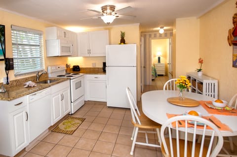 Orchid Cottage | Private kitchen | Full-size fridge, microwave, oven, stovetop