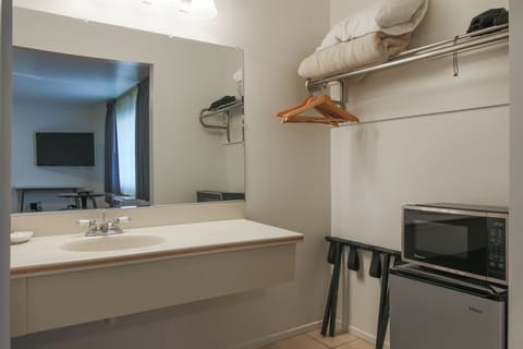 Standard Room, 2 Queen Beds | Bathroom | Combined shower/tub, free toiletries, hair dryer, towels