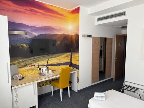 Economy Twin Room, 2 Twin Beds | Down comforters, minibar, in-room safe, desk