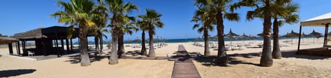 Private beach, white sand, sun loungers, beach umbrellas