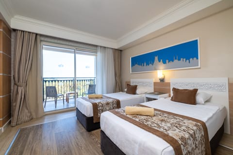 Family Room, 2 Bedrooms, Partial Sea View | Premium bedding, free minibar, in-room safe, desk