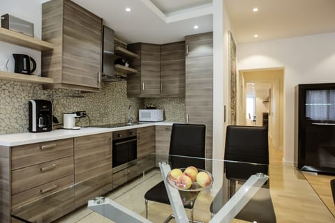 Executive Apartment, 1 Bedroom | Private kitchen | Fridge, microwave, dishwasher, coffee/tea maker