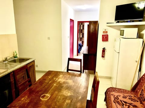 Economy Two-Bedroom Apartment (5 beds) | Living area | Flat-screen TV