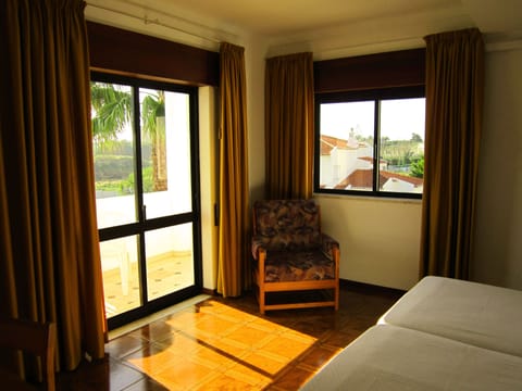 Family Room, Balcony, Pool View | Minibar, in-room safe, desk, free WiFi