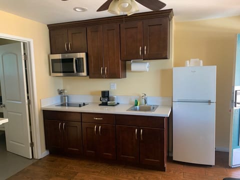 Family Suite, Multiple Beds | Private kitchen | Mini-fridge, microwave, coffee/tea maker