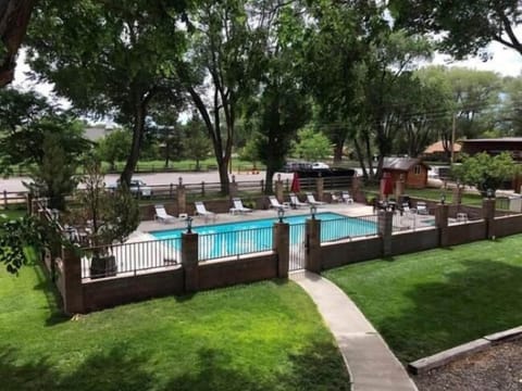 Seasonal outdoor pool, open 9:00 AM to 10:00 PM, pool umbrellas