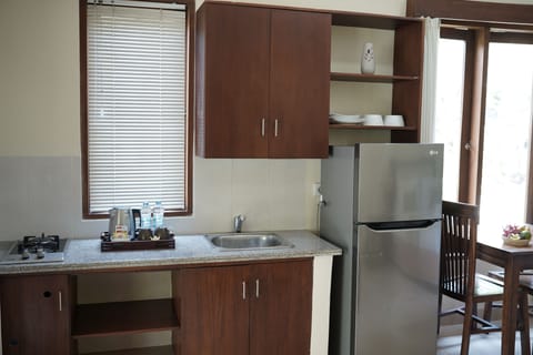 Studio Deluxe with Pool View | Private kitchen | Fridge, coffee/tea maker, electric kettle, toaster