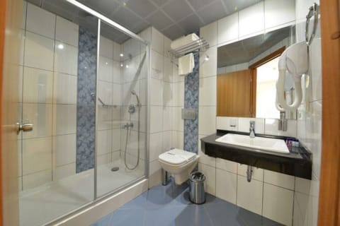 Family Room, Pool Access, Pool View | Bathroom | Shower, hair dryer, slippers, towels