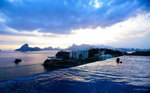 Outdoor pool, pool umbrellas, sun loungers