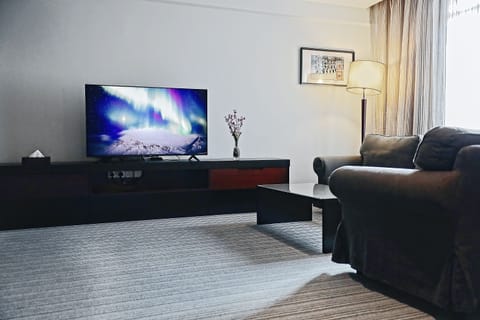 Executive Suite | Living area | 30-inch TV with digital channels