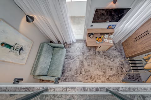 Luxury Suite | Living area | 110-cm Smart TV with digital channels, TV, Netflix