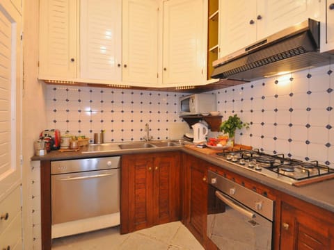 Villa | Private kitchen | Cookware/dishes/utensils, dining tables