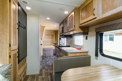 RV Trailer, WIFI, Cable TV, Private Fishing Dock, (bedding/towel extra$ or bring your own), No pets | Living area | 32-inch Smart TV with cable channels, TV