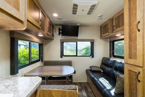 RV Trailer, WIFI, Cable TV, Private Fishing Dock, (bedding/towel extra$ or bring your own), No pets | Living area | 32-inch Smart TV with cable channels, TV