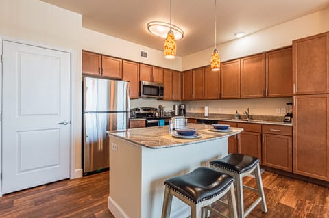 Deluxe Apartment | Private kitchen | Dining tables