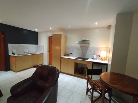 Executive Suite | Private kitchen | Fridge, coffee/tea maker, electric kettle