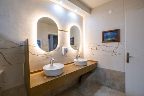 Shower, hair dryer, slippers, towels