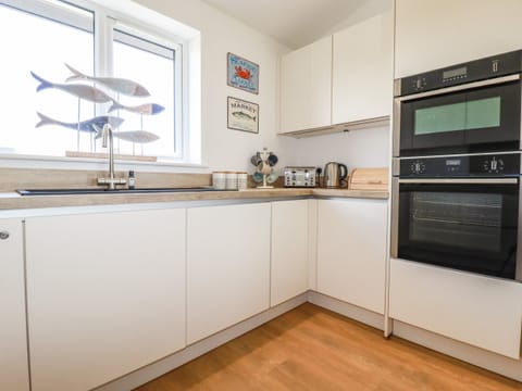 Fridge, electric kettle, toaster, cookware/dishes/utensils