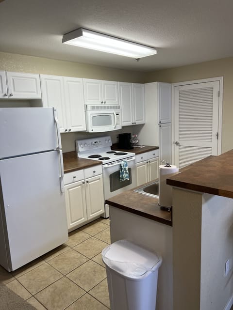 Family Apartment, 3 Bedrooms | Private kitchen | Full-size fridge, microwave, oven, stovetop