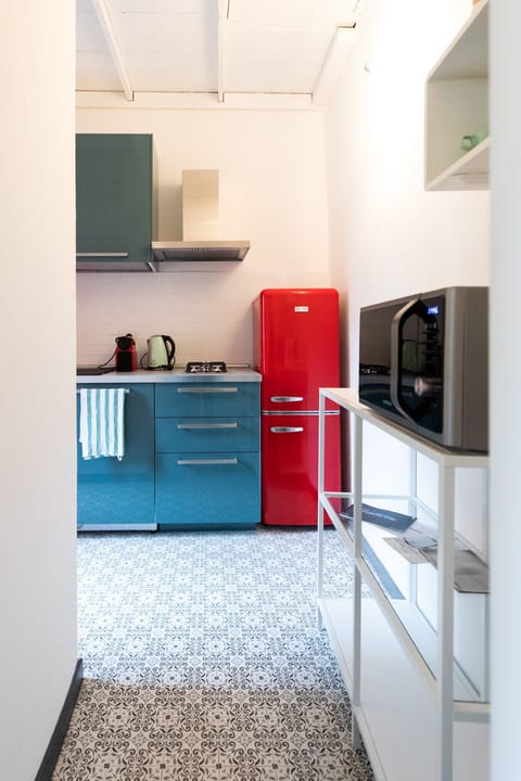 Apartment | Private kitchen | Fridge, stovetop, cookware/dishes/utensils