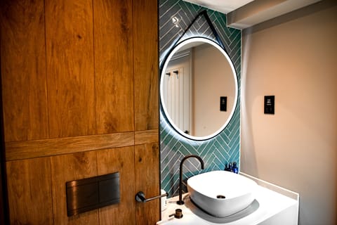 Junior Suite, Hot Tub | Bathroom | Hair dryer, bathrobes, slippers, heated floors