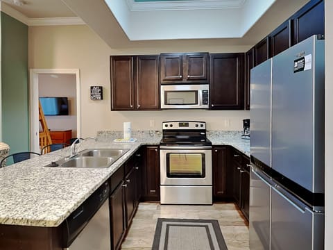 Condo, Multiple Beds, Balcony, Garden View (#E202 - No Pets Allowed) | Private kitchen | Fridge, microwave, oven, stovetop