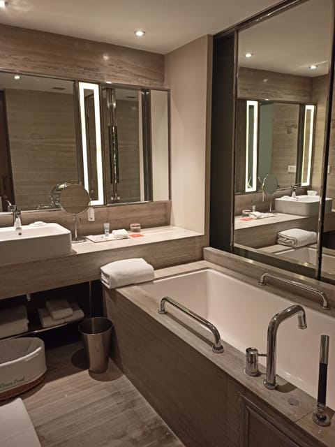 Suite, 1 King Bed | Bathroom | Shower, free toiletries, hair dryer, bathrobes