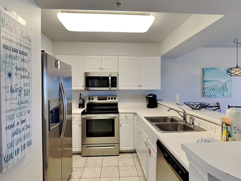 Condo, Multiple Beds, Balcony, Ocean View (Pelican Isle #104 - No Pets Allowed) | Private kitchen | Fridge, oven, dishwasher, coffee/tea maker