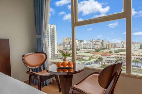 Deluxe Room, 2 Twin Beds, City View | In-room dining