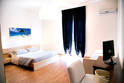 Quadruple Room, Balcony | In-room safe, desk, blackout drapes, free WiFi