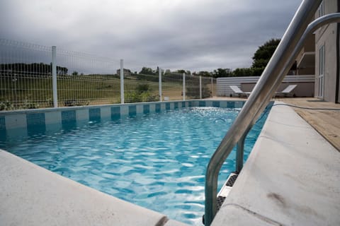 Seasonal outdoor pool, open 9:00 AM to 8:00 PM, sun loungers