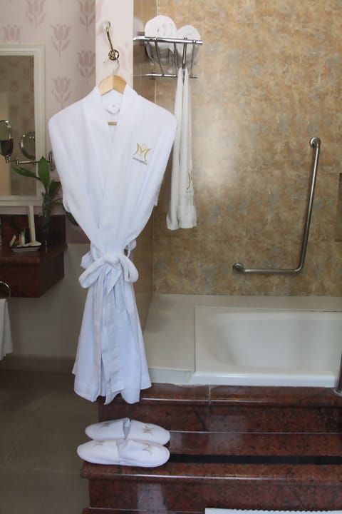 Master Suite | Bathroom | Rainfall showerhead, designer toiletries, hair dryer, bathrobes