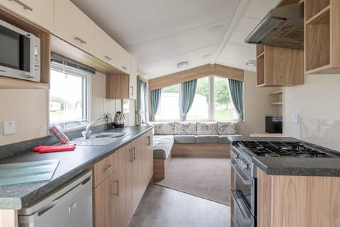 8 Berth Comfort Caravan | Living area | Flat-screen TV