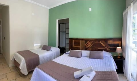 Deluxe Triple Room, Partial Sea View | Blackout drapes, free WiFi, bed sheets